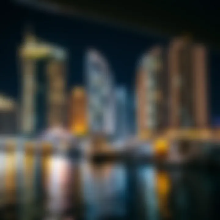Night view of Dubai Marina illuminated buildings reflecting on the water