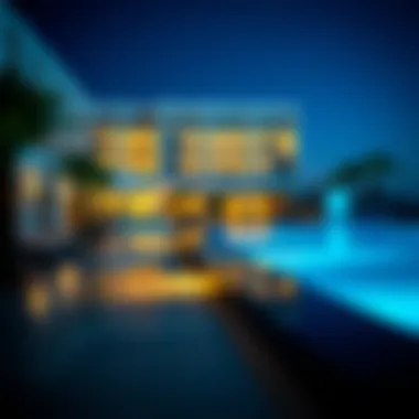 Evening view of a hotel with private pool, illuminated by soft lights