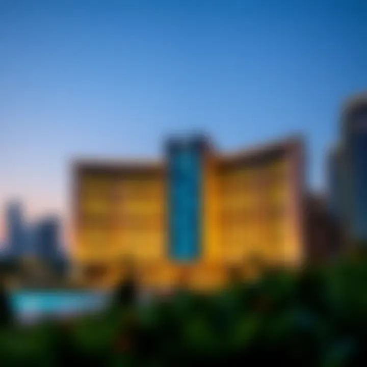 Exterior view of Moza Plaza at dusk, illuminated against the Dubai skyline