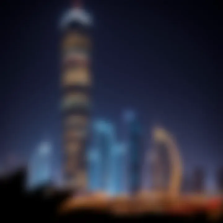 Night view of Tamouh Tower illuminated against the Abu Dhabi skyline