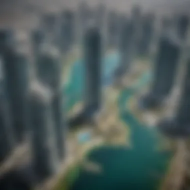 An aerial perspective of the turquoise lakes surrounded by the JLT buildings.